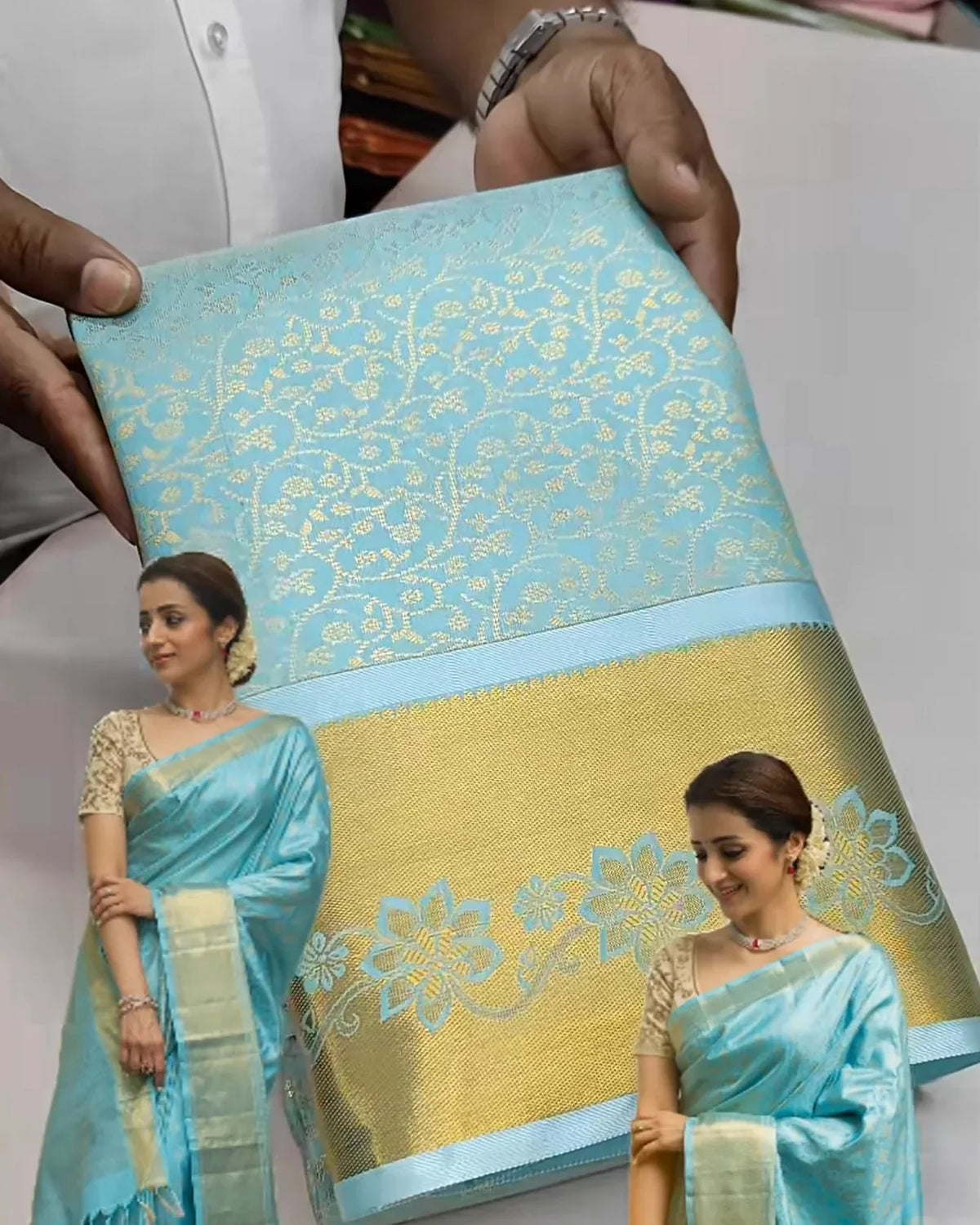 promotional image of a saree with a woman wearing it, held by a person.